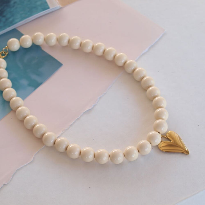 widaro ketting big round cream/yellow gold