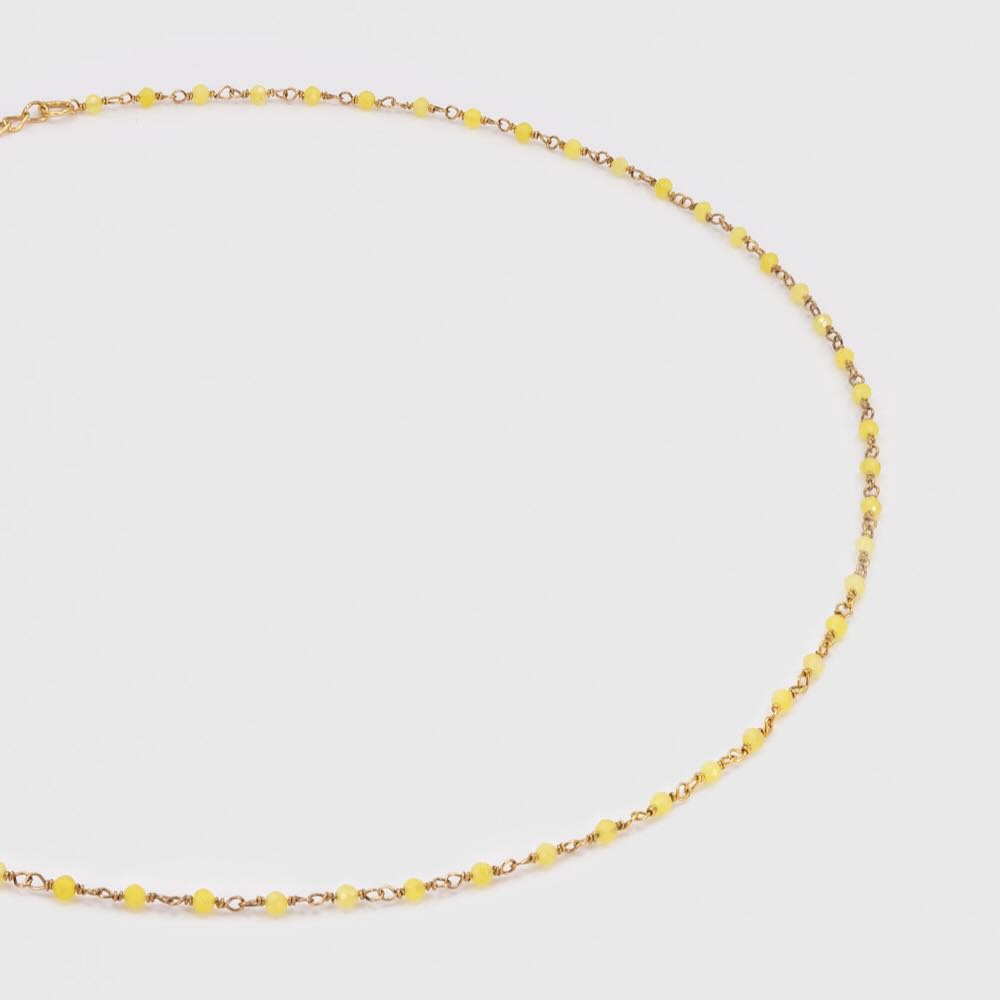 une a une ketting inde jaune