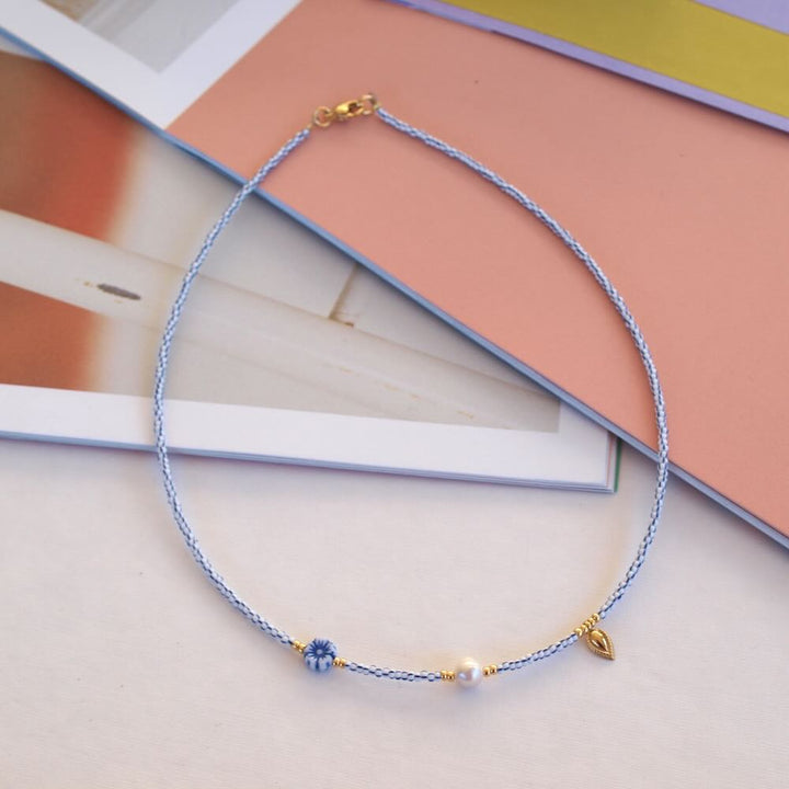 Widaro ketting pearl charm blue stripes