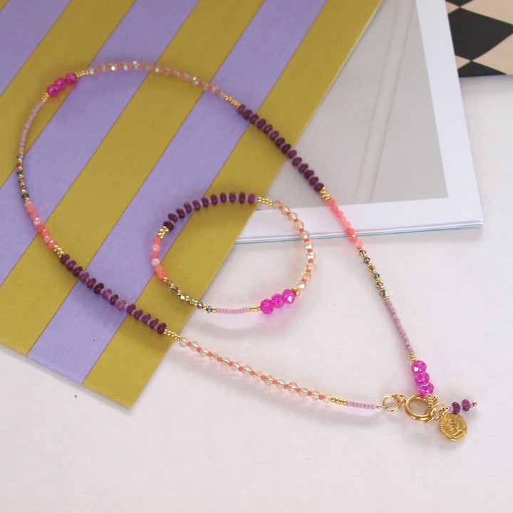 widaro halflange ketting purple and fuchsia beads