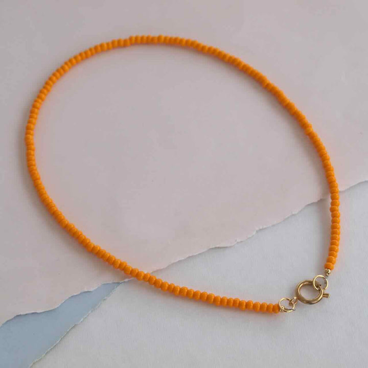 widaro ketting light orange/neon pink beads